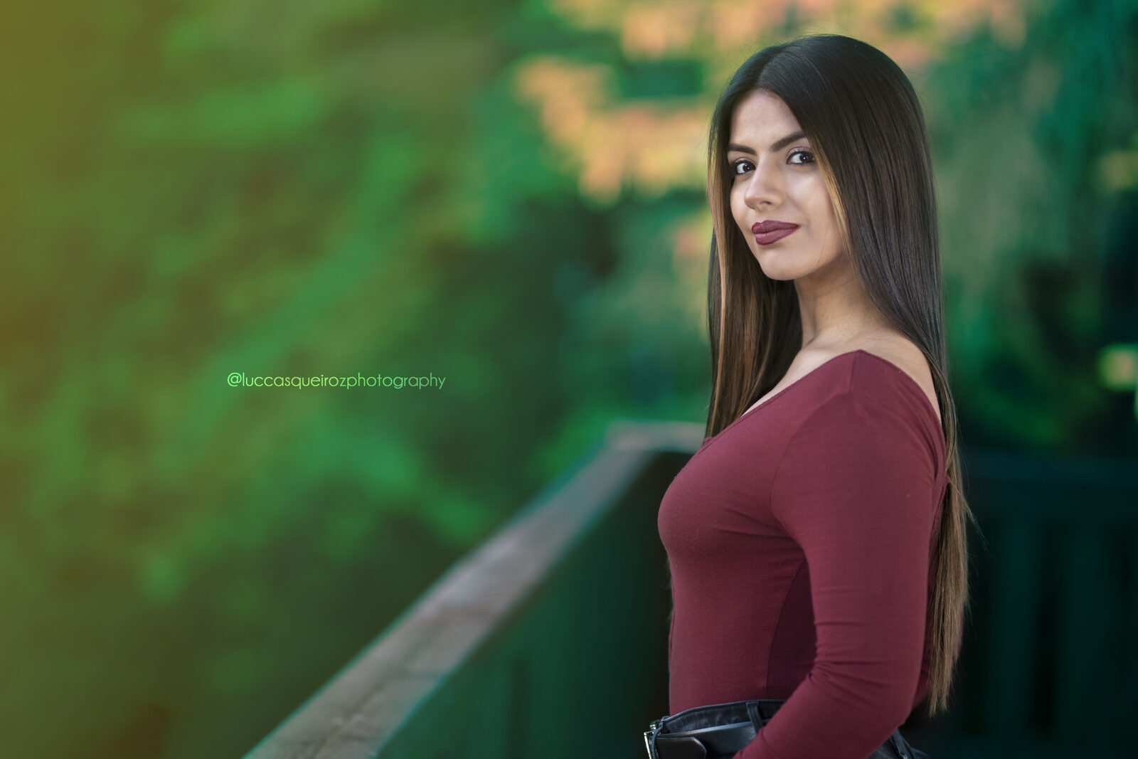 Portrait against green foliage