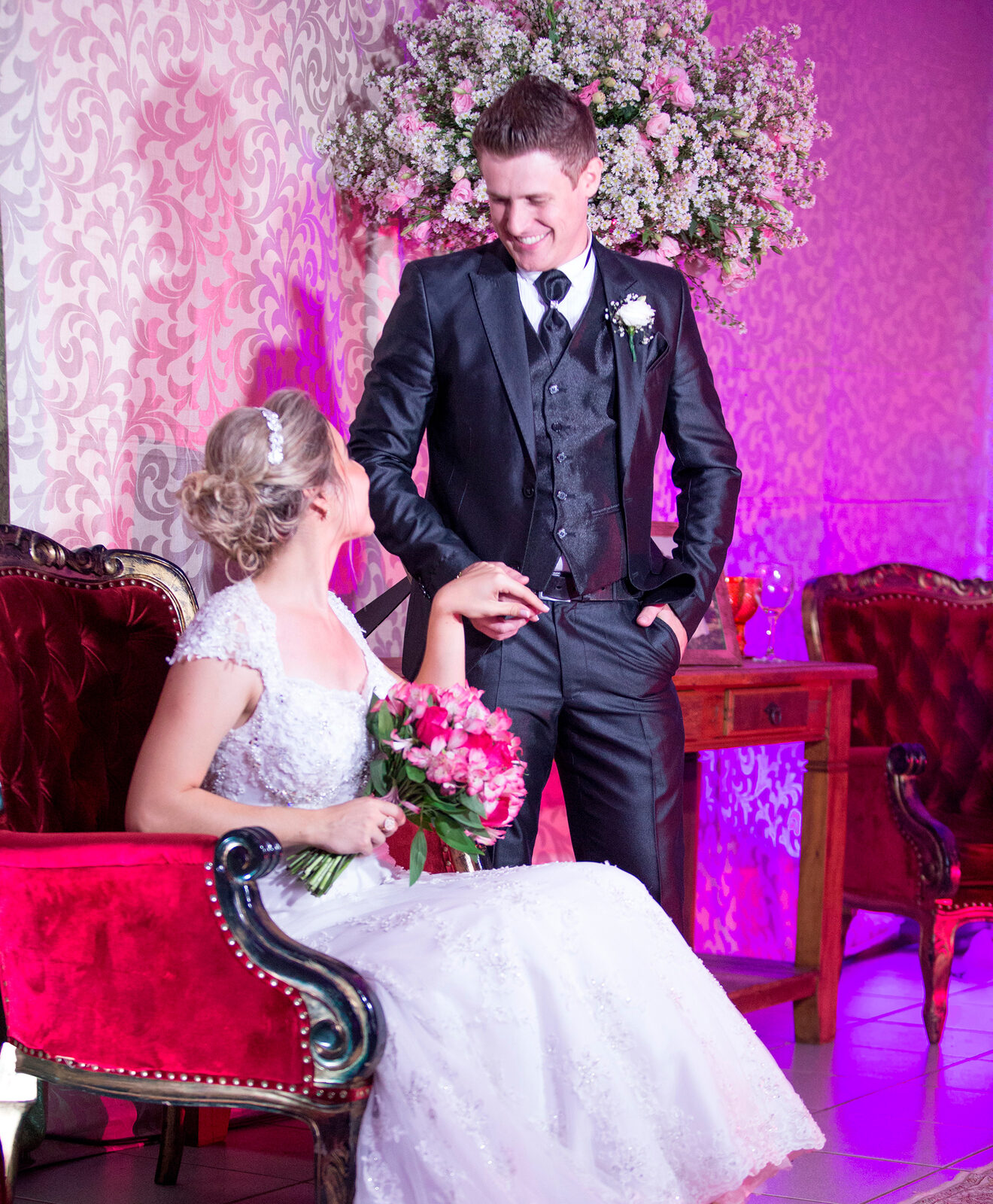 Bride holding a red bouquet